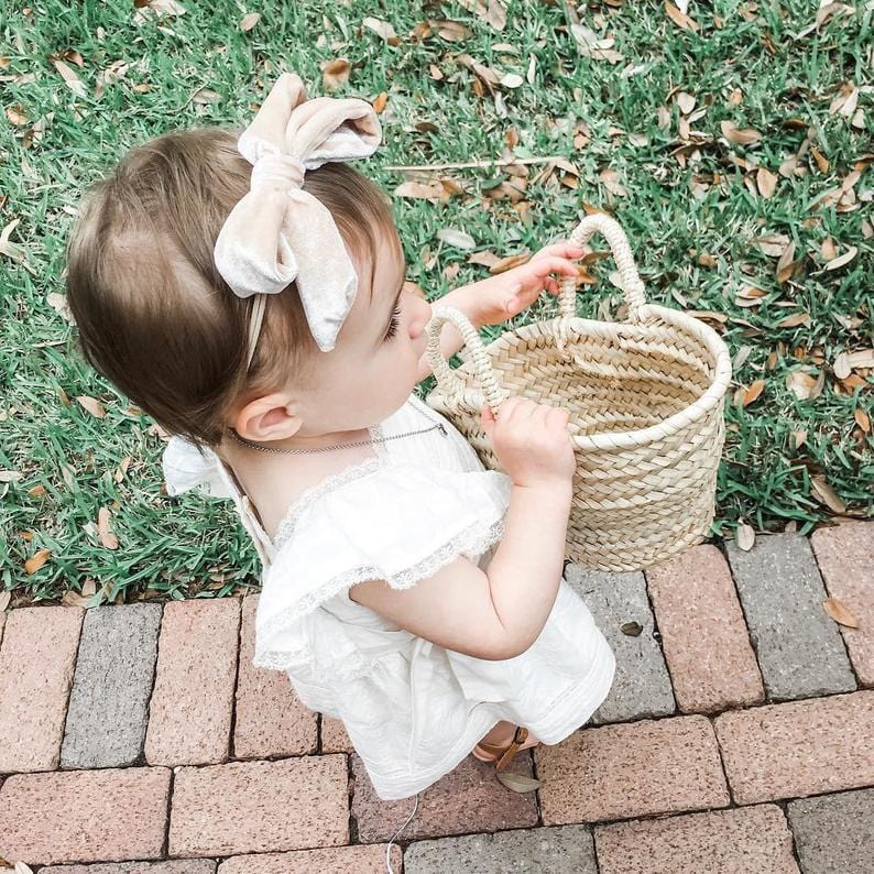 small straw basket with woven handles