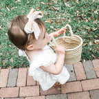 small straw basket with woven handles
