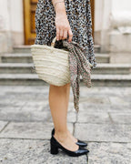 small straw basket with woven handles